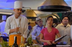 cooks and waiters sing for patrons